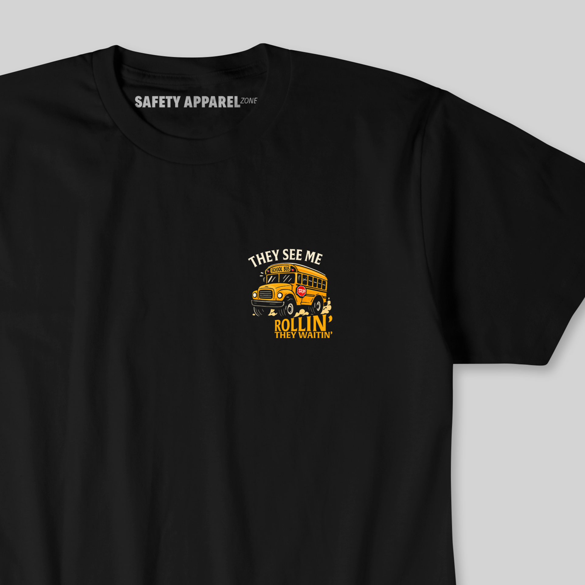 Black t-shirt with a yellow school bus and text on a gray background